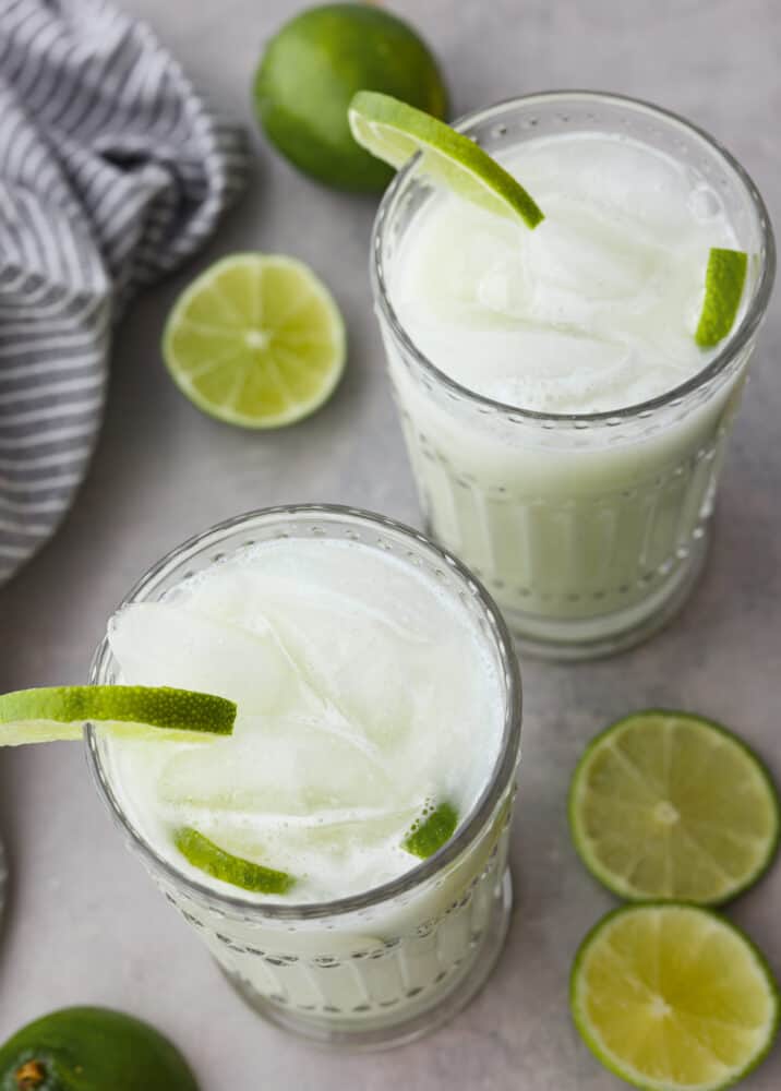 Top-down view of 2 glasses of Brazilian lemonade.