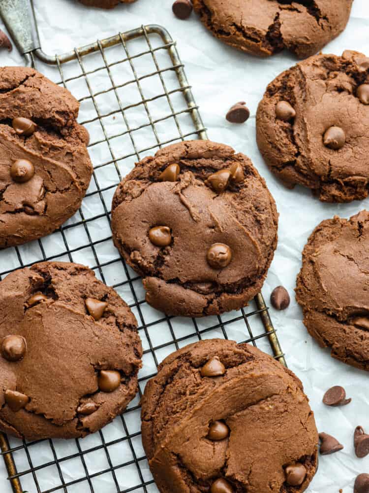 The top view of chocolate cake mix cookies cooked and on a cooling rack. 