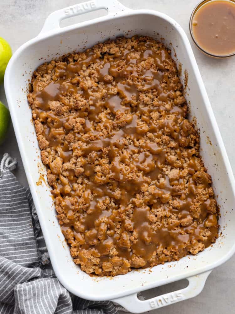 The top view of dutch caramel apple bir bars in a baking dish, waiting to be cut. 