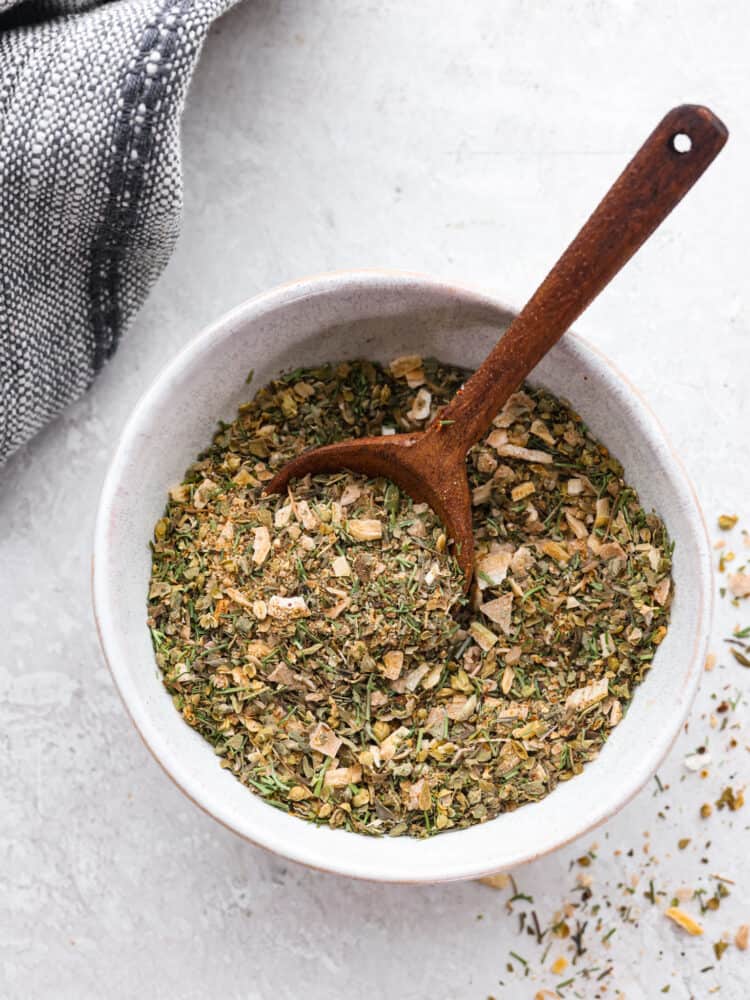 Top-down view of Greek seasoning in a white bowl.