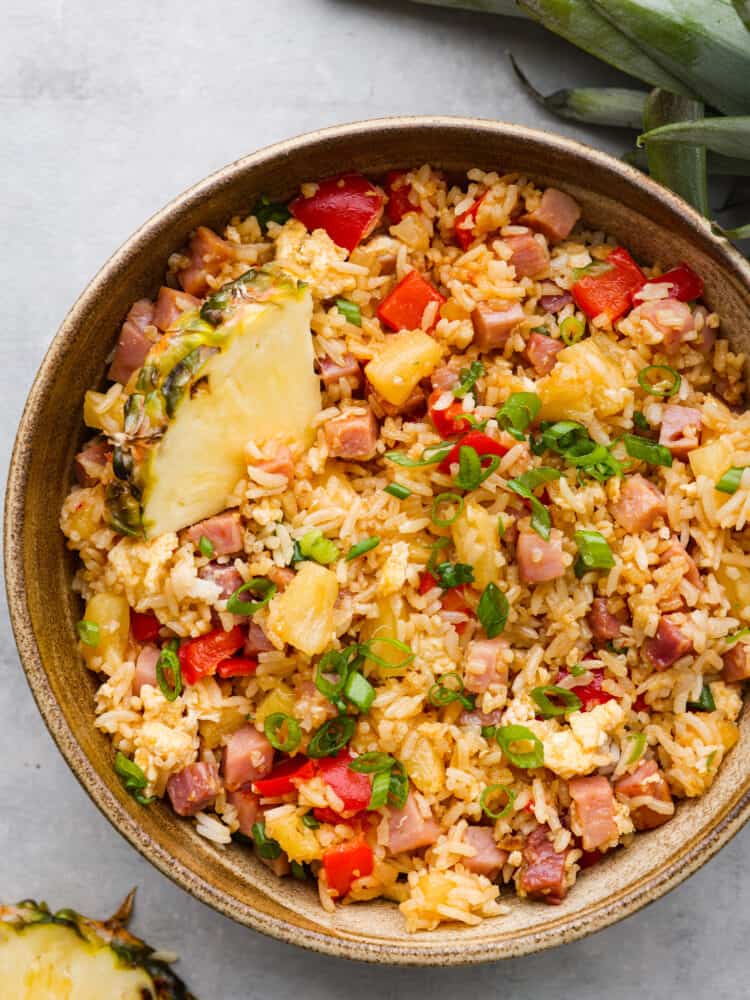 Hawaiian fried rice in a brown bowl, ready to eat. 