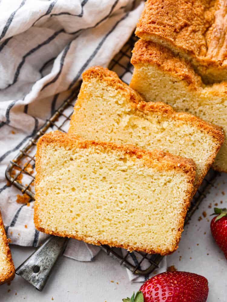 Pound cake sliced up and laid out on a wire rack.