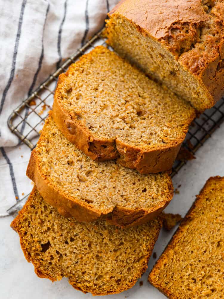 Top-down view of sweet potato bread, cut into thick slices.