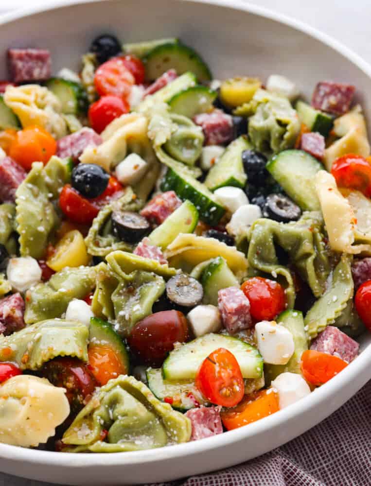 A close up of a bowl of Italian Tortellini Pasta Salad. 