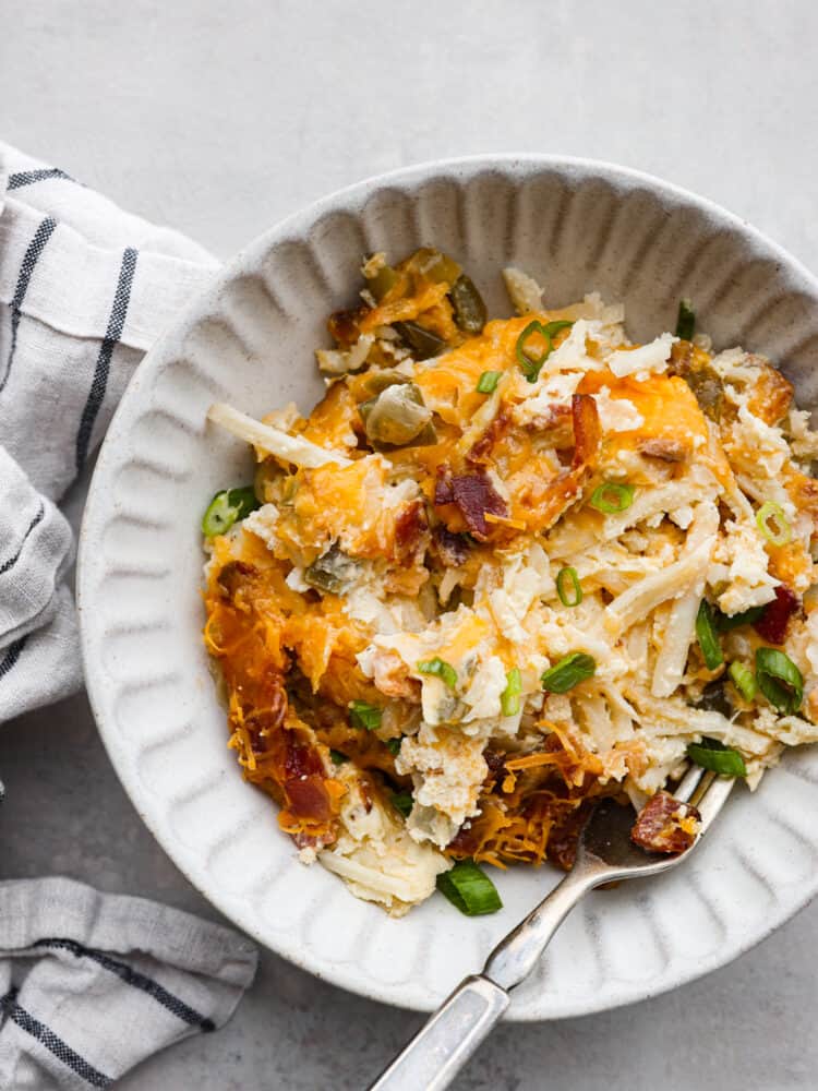 A white bowl filled with breakfast casserole.