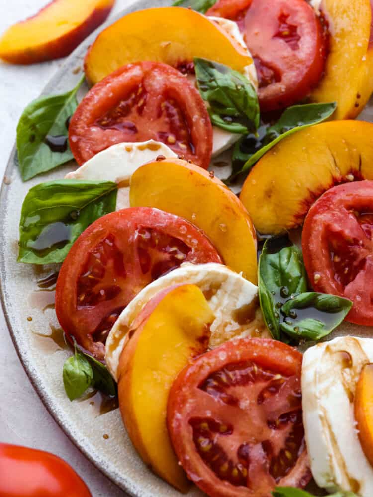 Closeup of peach Caprese salad.