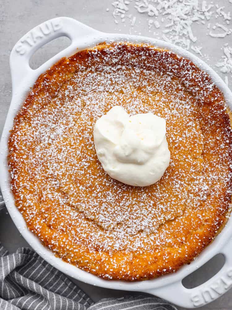 Top-down view of an entire impossible pie, garnished with shredded coconut.