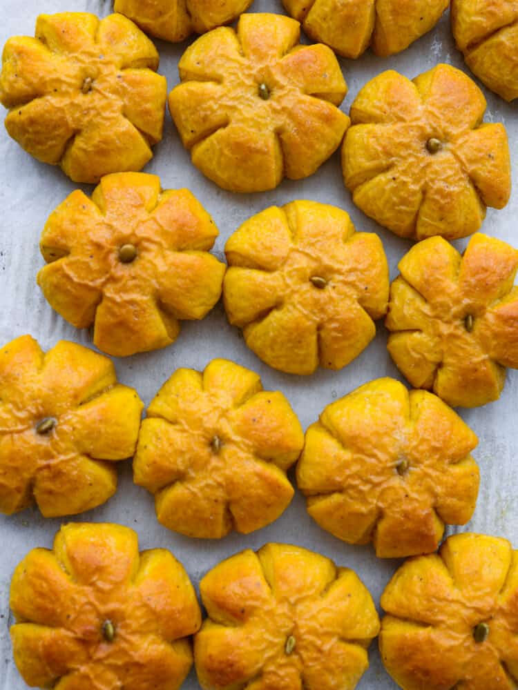 The top view of pumpkin rolls on a baking sheet. 