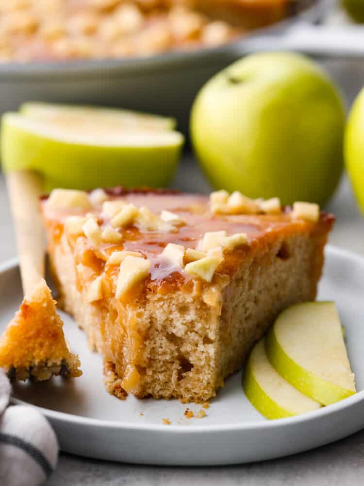 Front view of a slice of cake with a bite taken out of it.