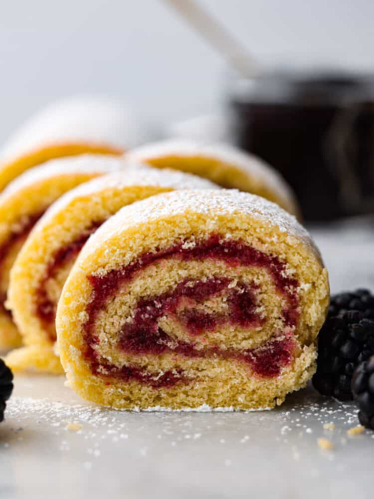 Jelly roll cake cut up and assembled on a plate.