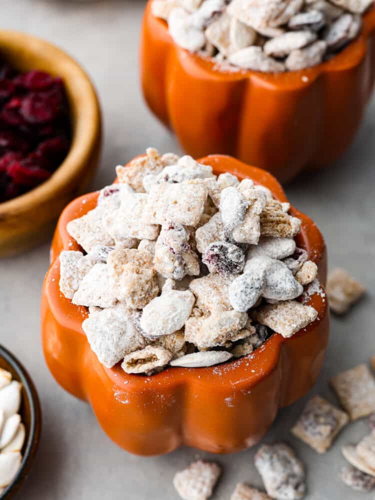 Closeup of pumpkin spice buddies in a pumpkin-shaped jar.