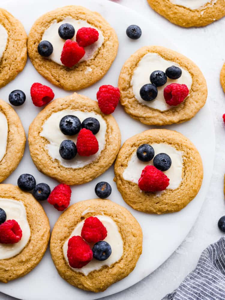 The top view of cheesecake cookies on some parchment paper. 