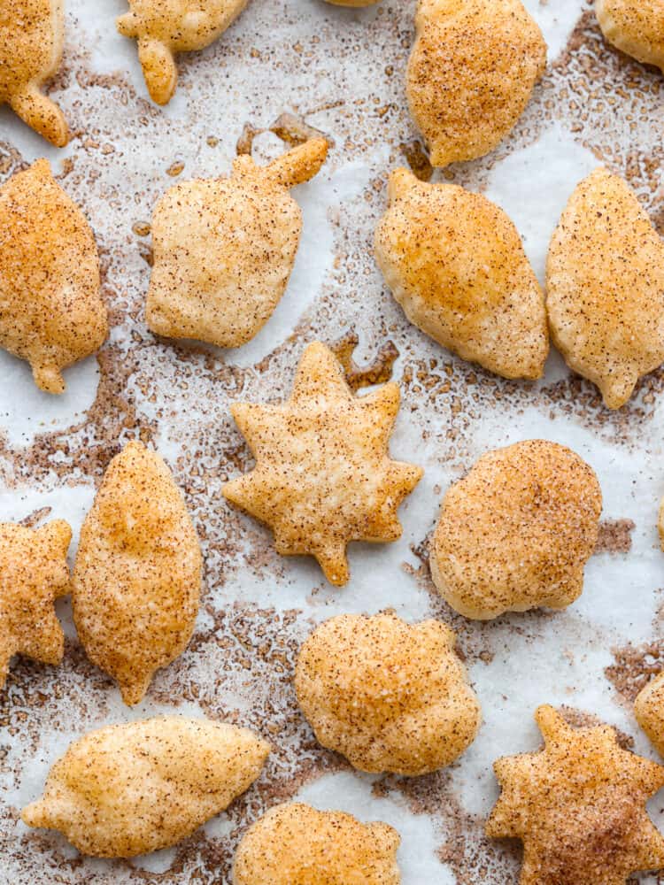 Top view of pie crust cookies on parchment paper.