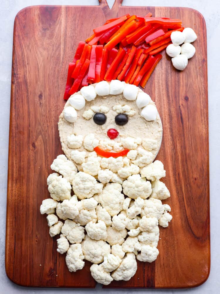 Santa's beard being made out of cauliflower florets.