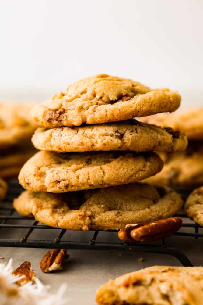 4 butter pecan cookies stacked on top of each other.