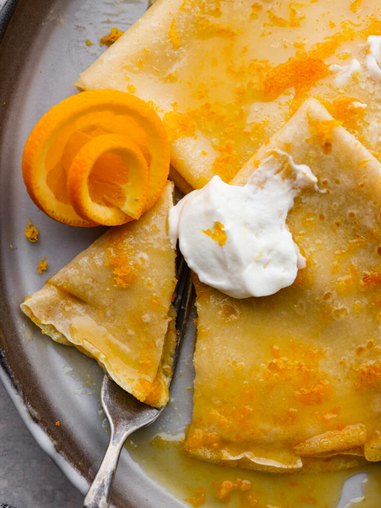 Closeup of a bite being taken out of a crepe.