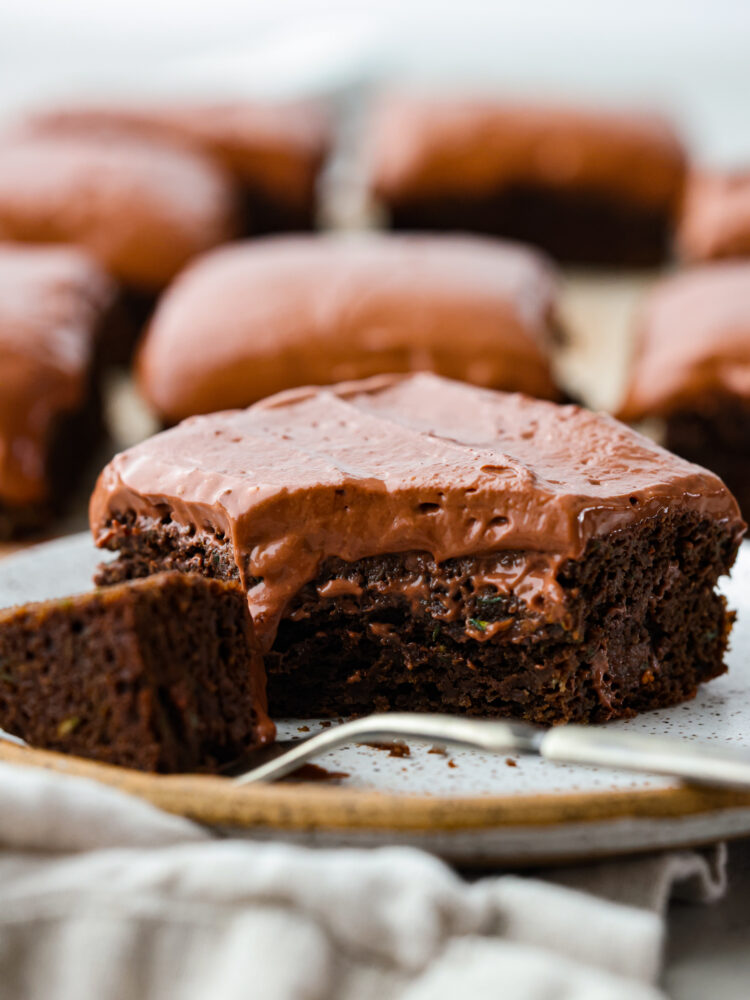 Chocolate healthy brownies with a scoop taken out of it on the fork.