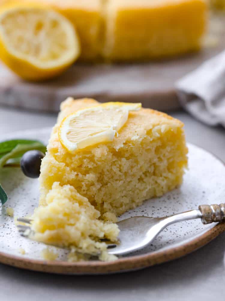 A slice of cake on a stoneware plate.