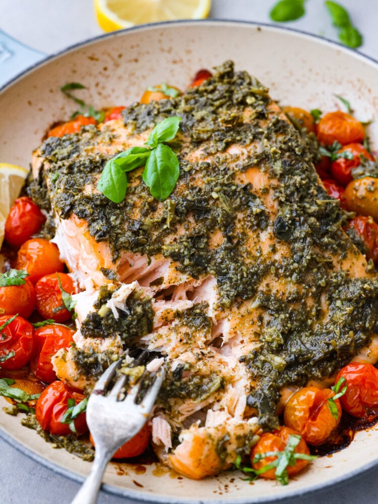 A picture showing how easily the salmon flakes with a fork in the pan.