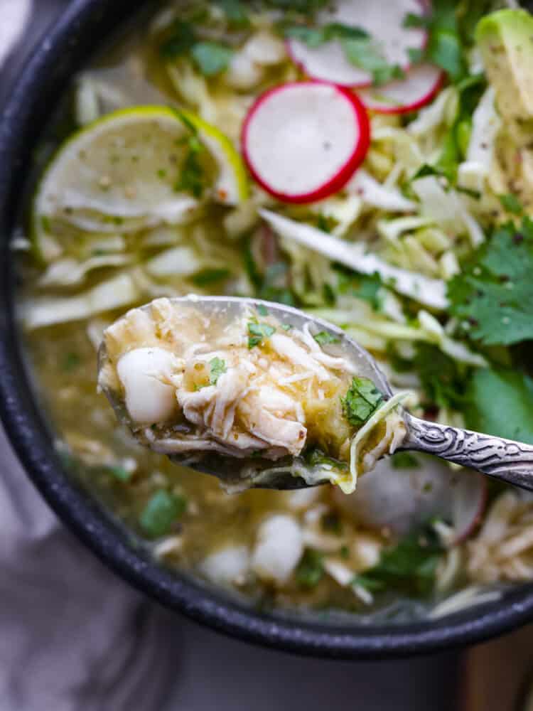 A close up on the pozole on a spoon.