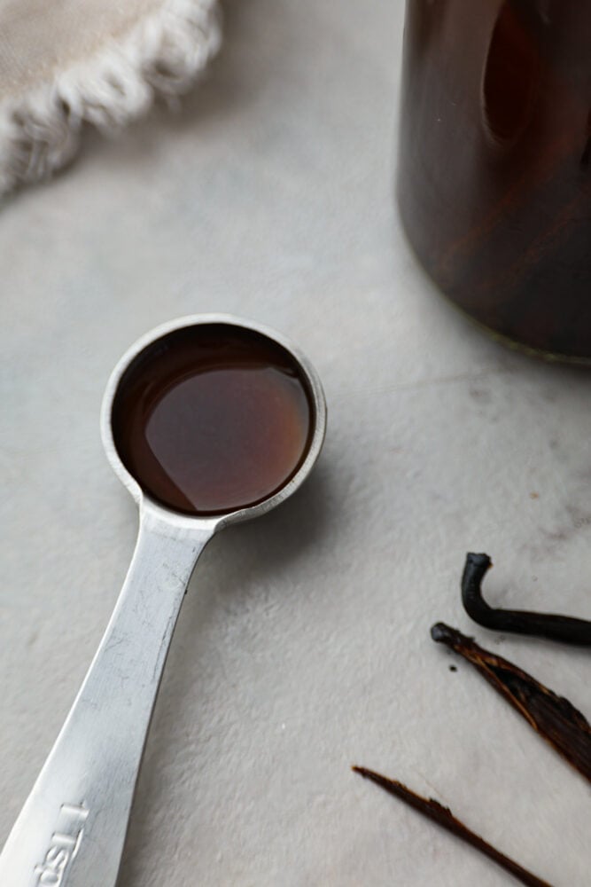 A measuring spoon filled with vanilla.