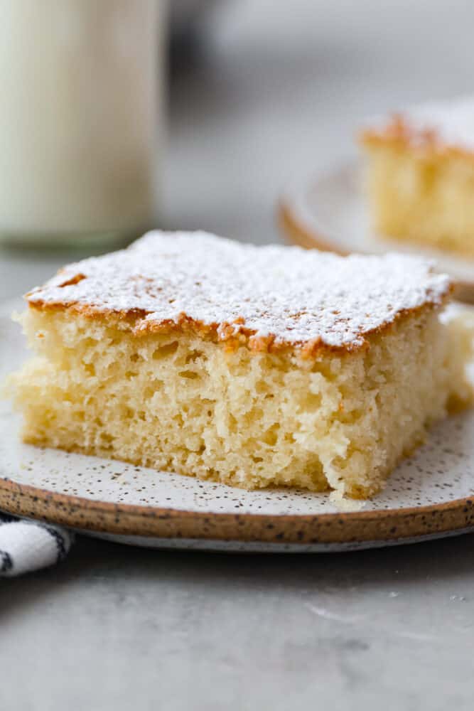 A piece of hot milk cake on a plate.