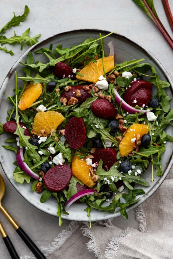 Top-down view of salad served in a gray stoneware bowl.