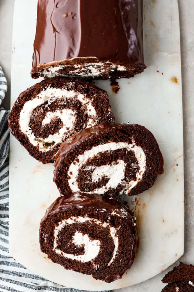 An overhead view of the swiss roll pieces on a cutting board.