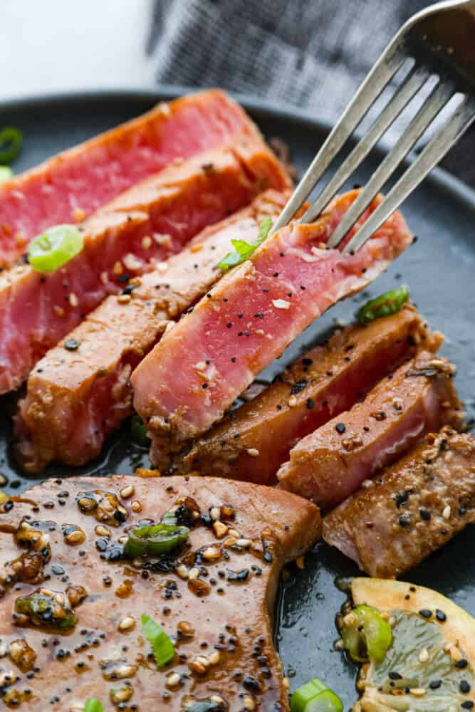 A close up on the dish with a fork taking a slice.