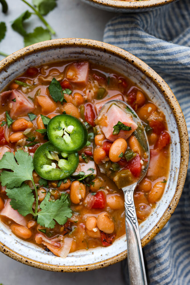 A close up of a bowl of charro beans.