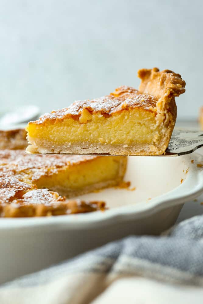 A slice of pie being served with a cake spatula.