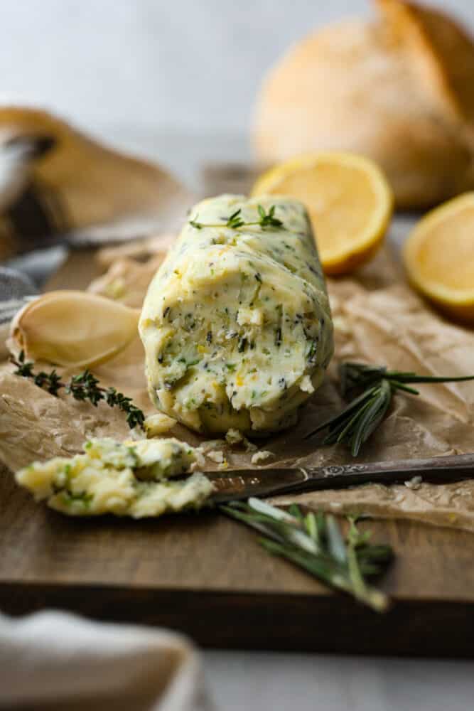 A close up of compound butter on the cutting board.