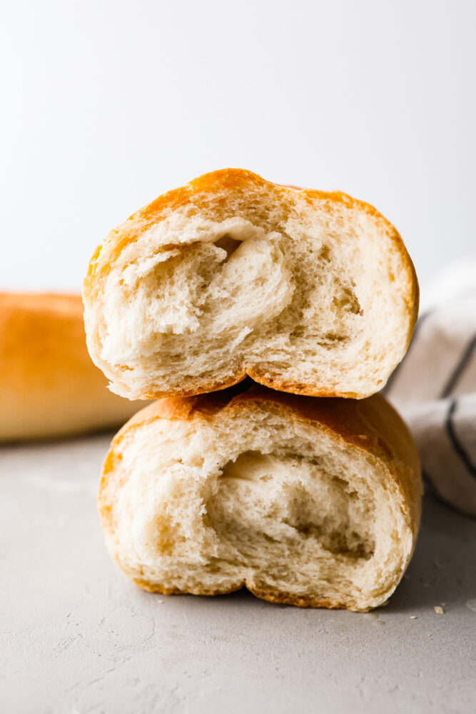 Two halves of Italian bread stacked on top of each other showing the inside.