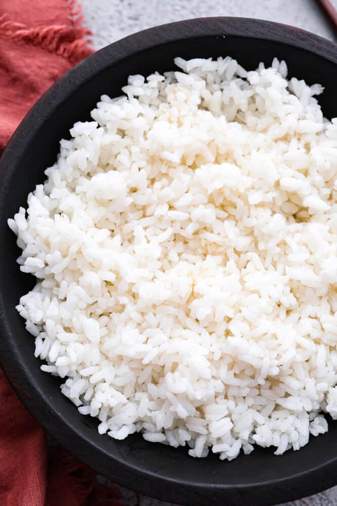 A close up of sushi rice in a bowl.