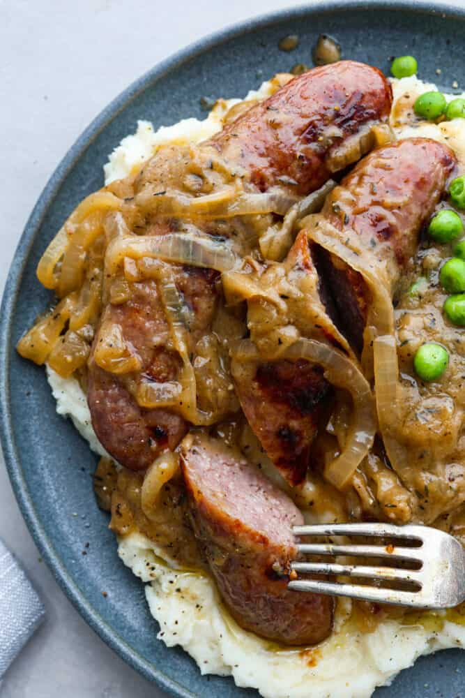 Closeup of bangers and mash.