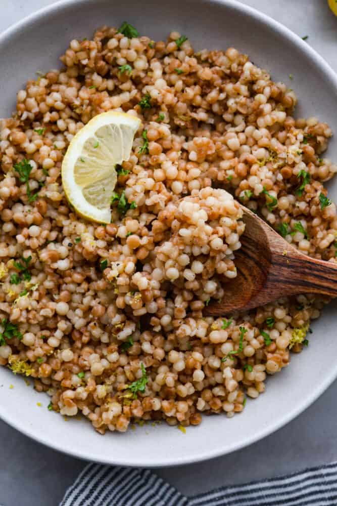 Closeup of a spoonful of couscous.