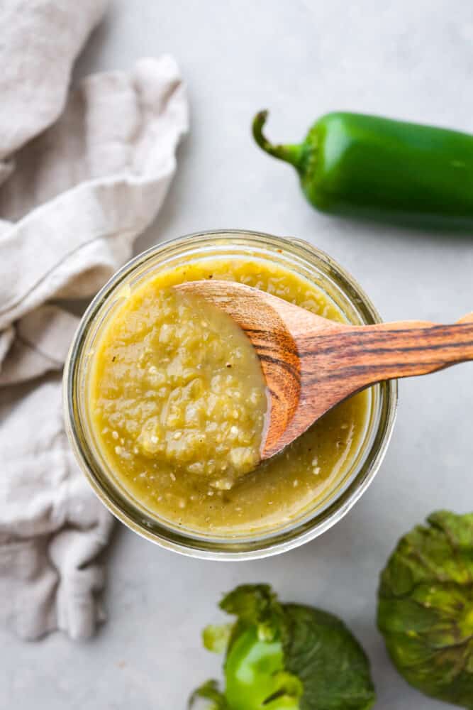 The top view of enchilada sauce in a jar. 