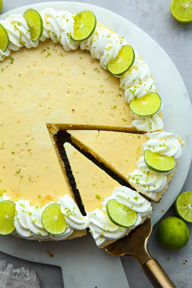 Top-down view of cheesecake, cut into slices.