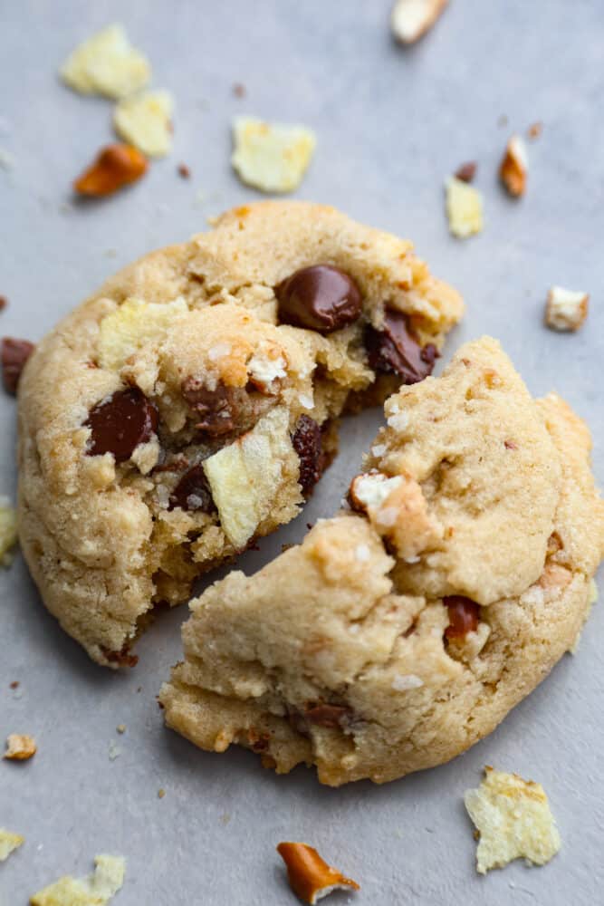 A kitchen sink cookie broken in half.