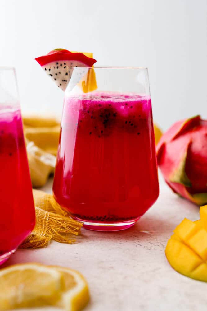 Hero image of a glass of mango dragon fruit lemonade.