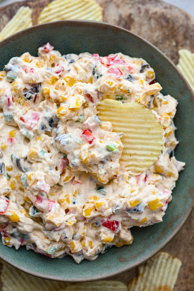 A closeup of a bowl of creamy ranch dip. 