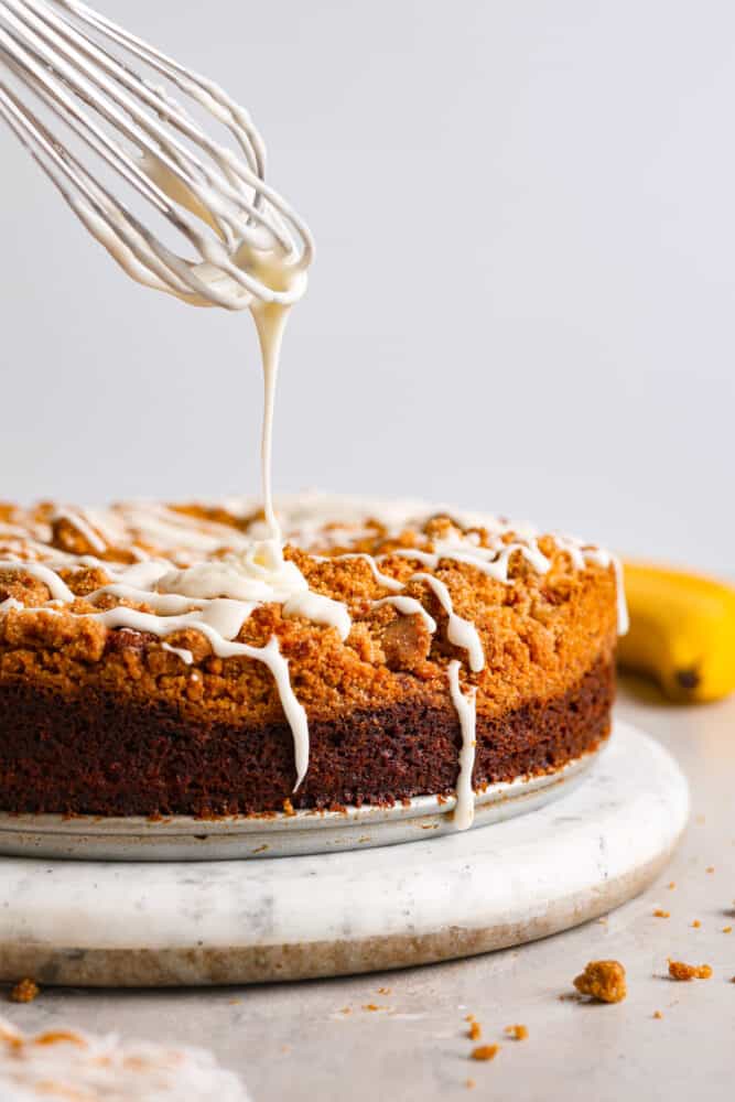 Glaze being drizzled onto the cake.