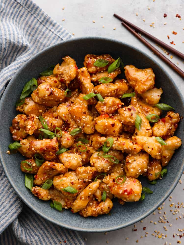 Top-down view of bang bang chicken served in a gray bowl.