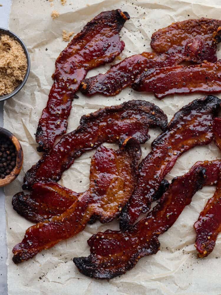 Cooked bacon on parchment paper.