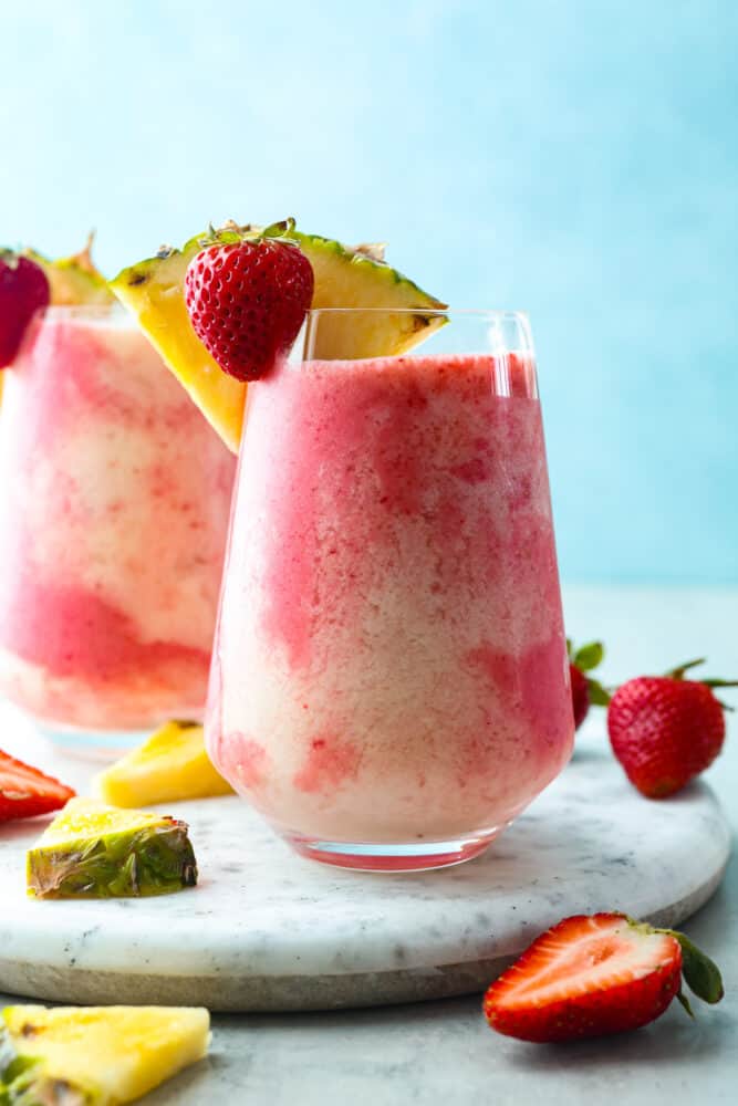 Hero image of 2 glasses filled with the lava flow cocktail.