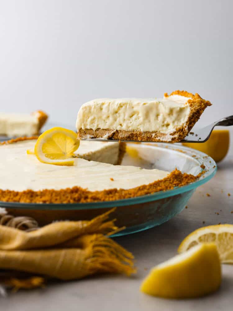 A slice of lemonade pie being served.