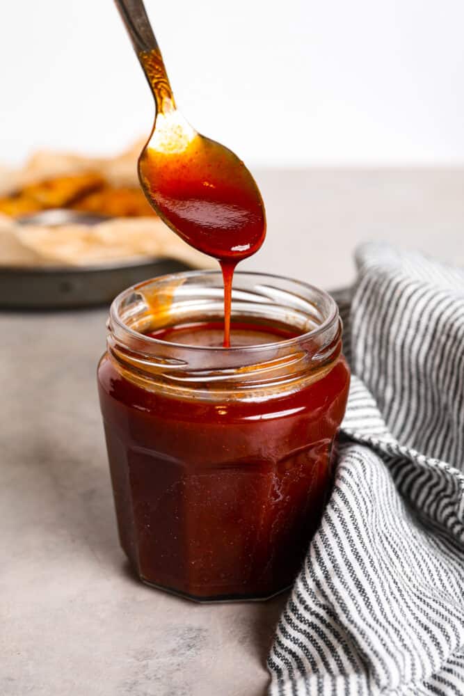 Hero image of mumbo sauce in a glass jar.