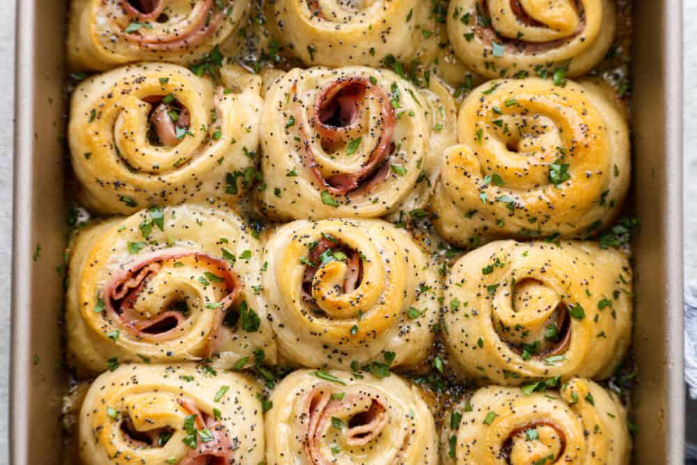 The top view of pinwheels in a baking sheet. 