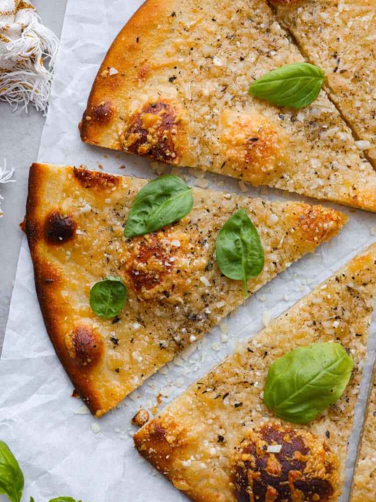 Closeup of a slice of cacio e pepe pizza.