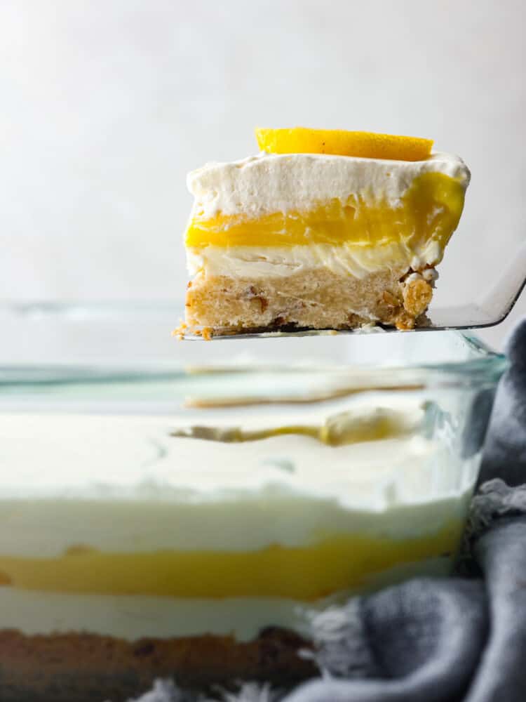 A slice of the dessert being served with a cake spatula.